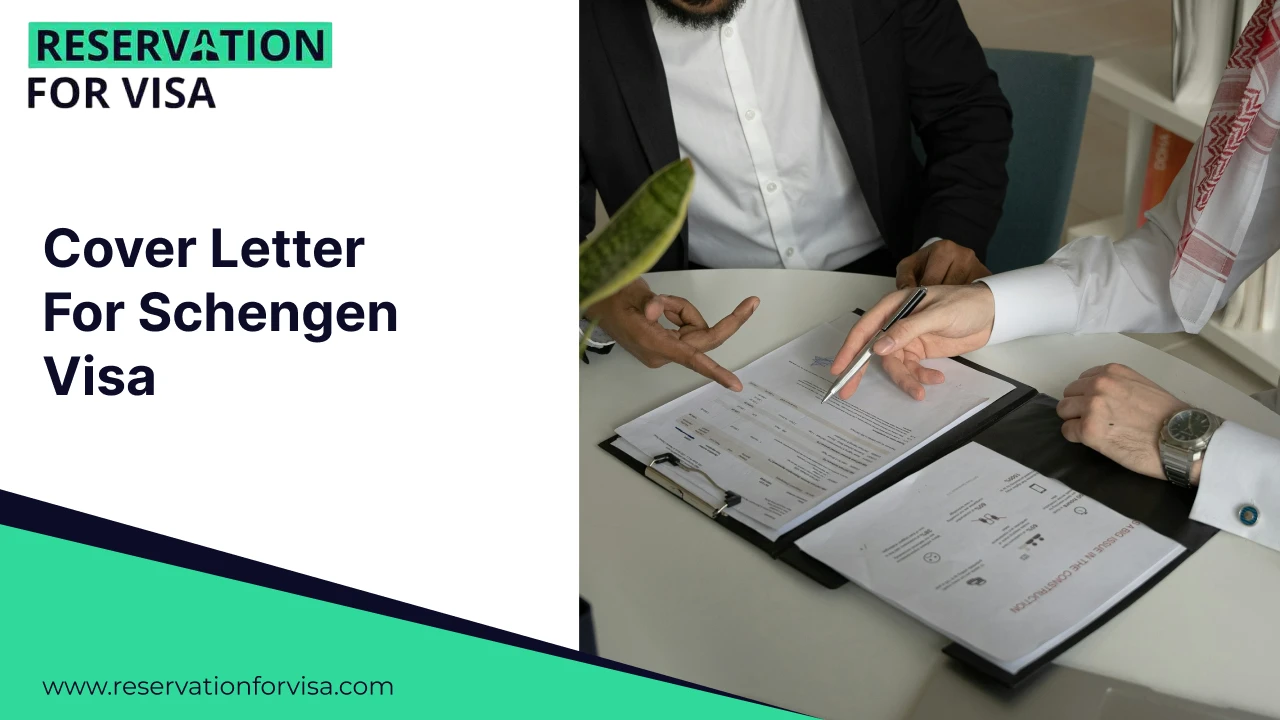 Close-up of two people at a desk reviewing and pointing to professional documents. The person on the right is wearing traditional Middle Eastern attire.