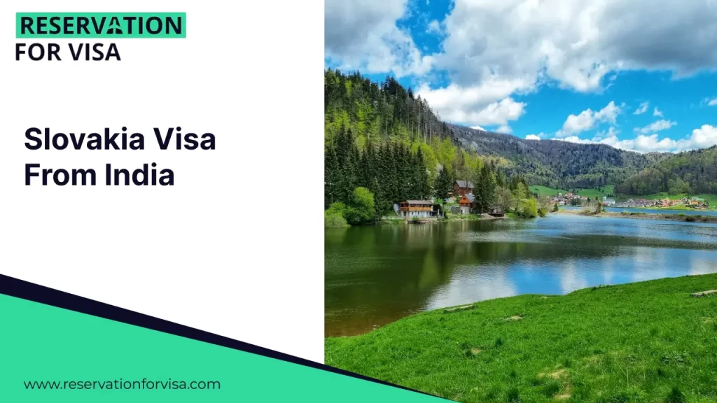 A promotional graphic for "Slovakia Visa From India" featuring a scenic view of a lake in the Slovakian countryside. Small, orange-roofed houses are nestled along the grassy shore, backed by dense green forests and rolling hills under a blue sky with fluffy white clouds.