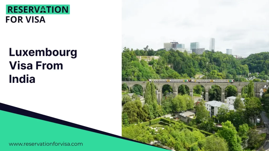 A lush green landscape in Luxembourg featuring a train crossing a historic stone arched viaduct, with modern city buildings in the distance