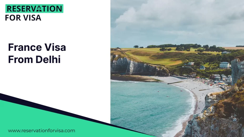 A promotional graphic for "France Visa From Delhi" by Reservation For Visa. The right side of the image showcases the scenic cliffs of Étretat along the Alabaster Coast in Normandy, featuring a pebble beach, turquoise water, and rolling green hills under a cloudy sky.