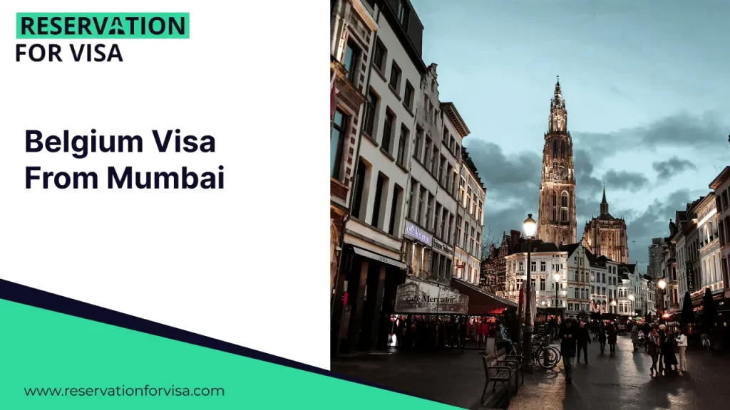 A promotional graphic for "Belgium Visa From Mumbai" by Reservation For Visa. The right side of the image features a twilight street view of Antwerp, dominated by the Gothic spire of the Cathedral of Our Lady towering over traditional Belgian architecture and a lit cafe.