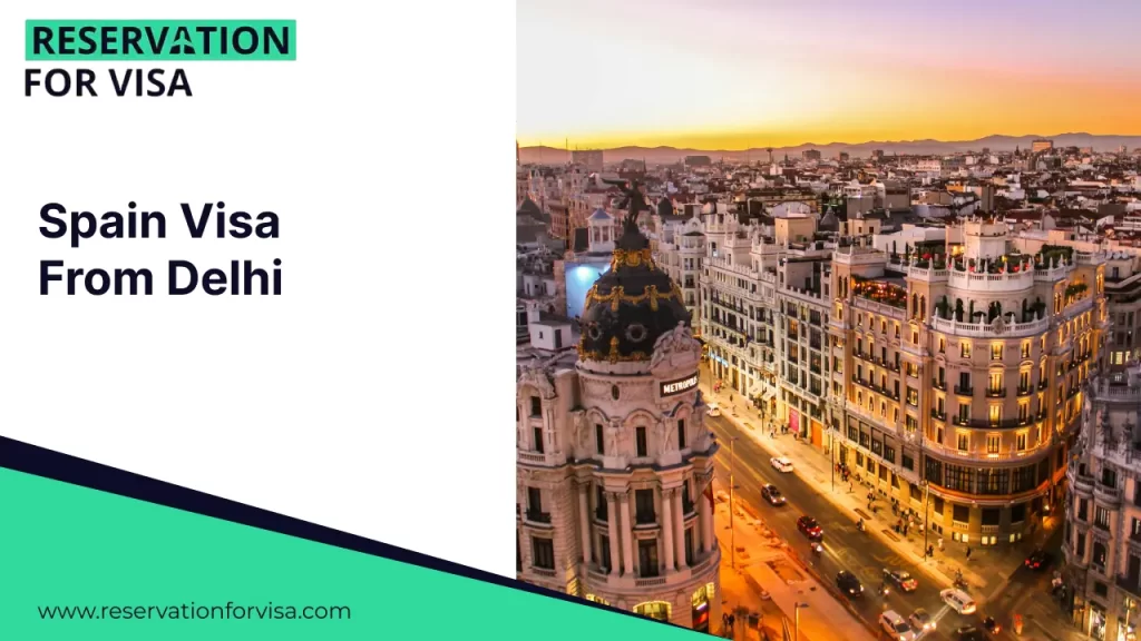 A promotional graphic for "Spain Visa From Delhi" by Reservation For Visa. The right side of the image features an elevated sunset view of the Metropolis Building in Madrid, highlighting its iconic black dome and gold leaf accents above the bustling Gran Vía street.